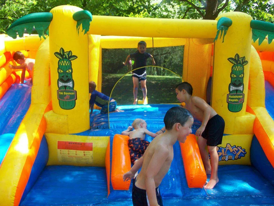 kids playing on water slide